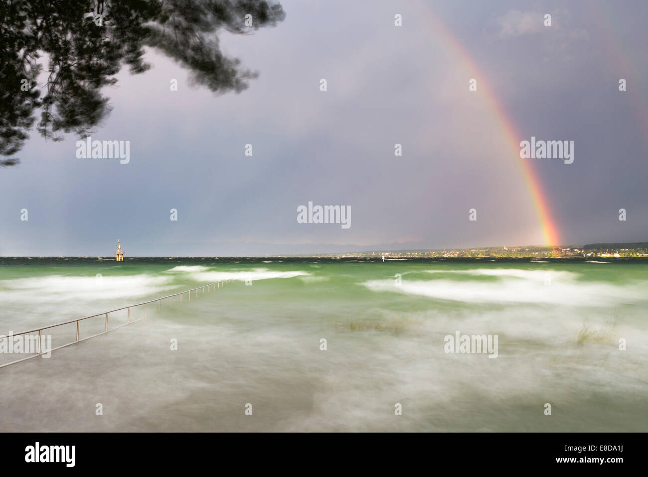Thunderstorm and high waves at the Horn outdoor pool, rainbow over Lake Constance, Konstanz, Baden-Württemberg, Germany Stock Photo