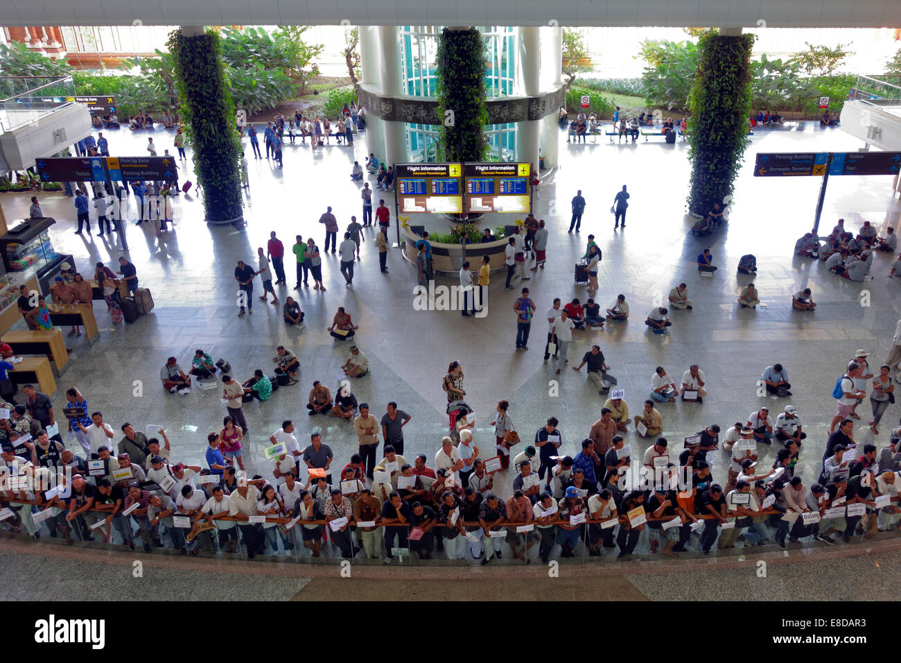 Concourse, arrival with waiting greeters, Ngurah Rai Airport or Denpasar International Airport, Tuban, Bali, Indonesia Stock Photo