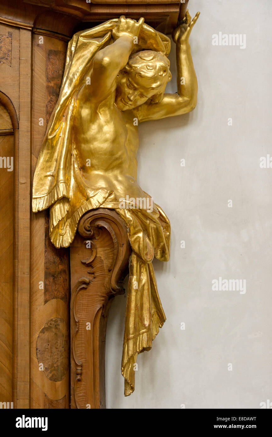 Atlas figure at the confessional, by Bartholomew Zwinck, baroque Church of the Assumption of St. Mary, Ettal Abbey, Ettal Stock Photo