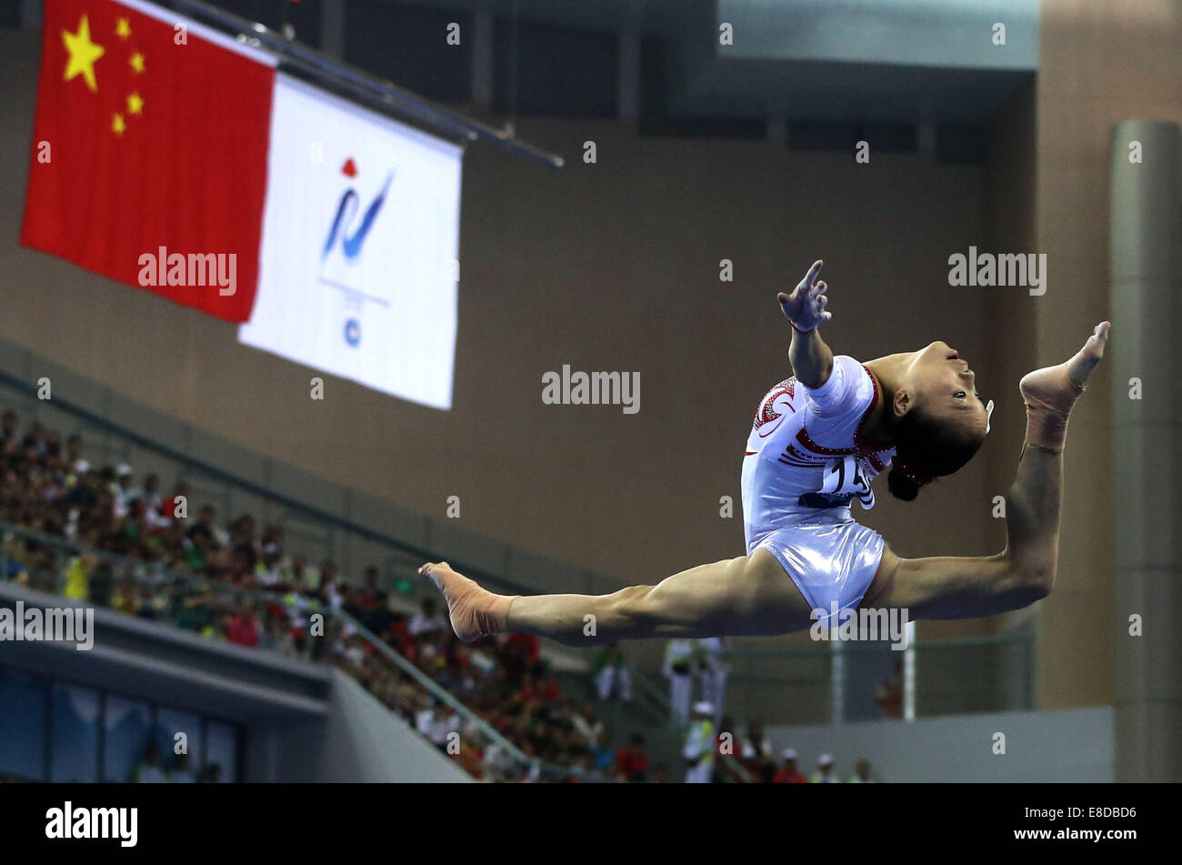 Nanning, China's Guangxi Zhuang Autonomous Region. 6th Oct, 2014. Chinese gymnast Yao Jinnan performs in the floor exercise during the women's qualifying round of the 45th Gymnastics World Championships in Nanning, capital of south China's Guangxi Zhuang Autonomous Region, Oct. 6, 2014. The 45th FIG Artistic Gymnastics World Championships lasts from Oct. 3 to 12 in Nanning. Credit:  Ma Zhenyu/Xinhua/Alamy Live News Stock Photo