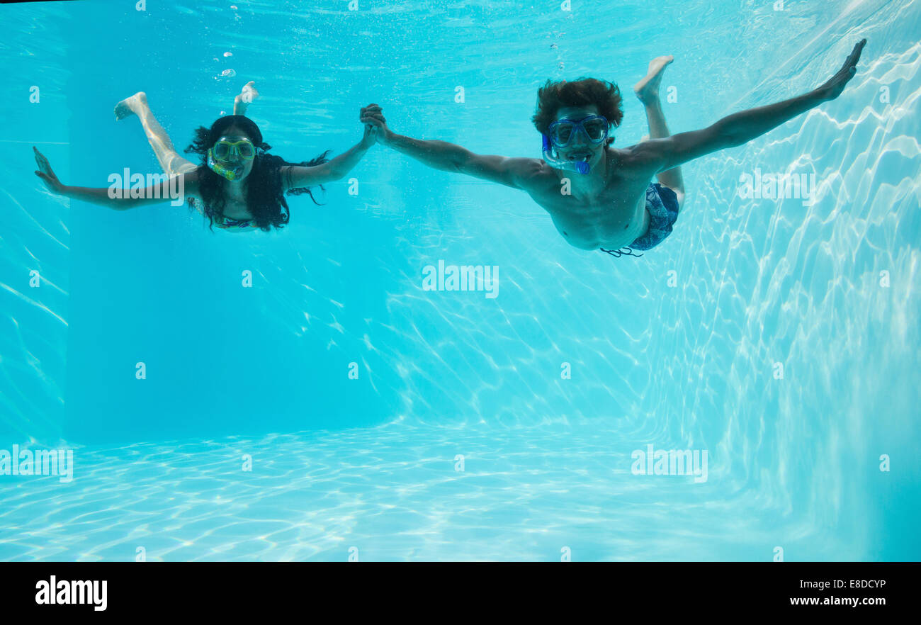 Couple wearing snorkels in swimming pool Stock Photo