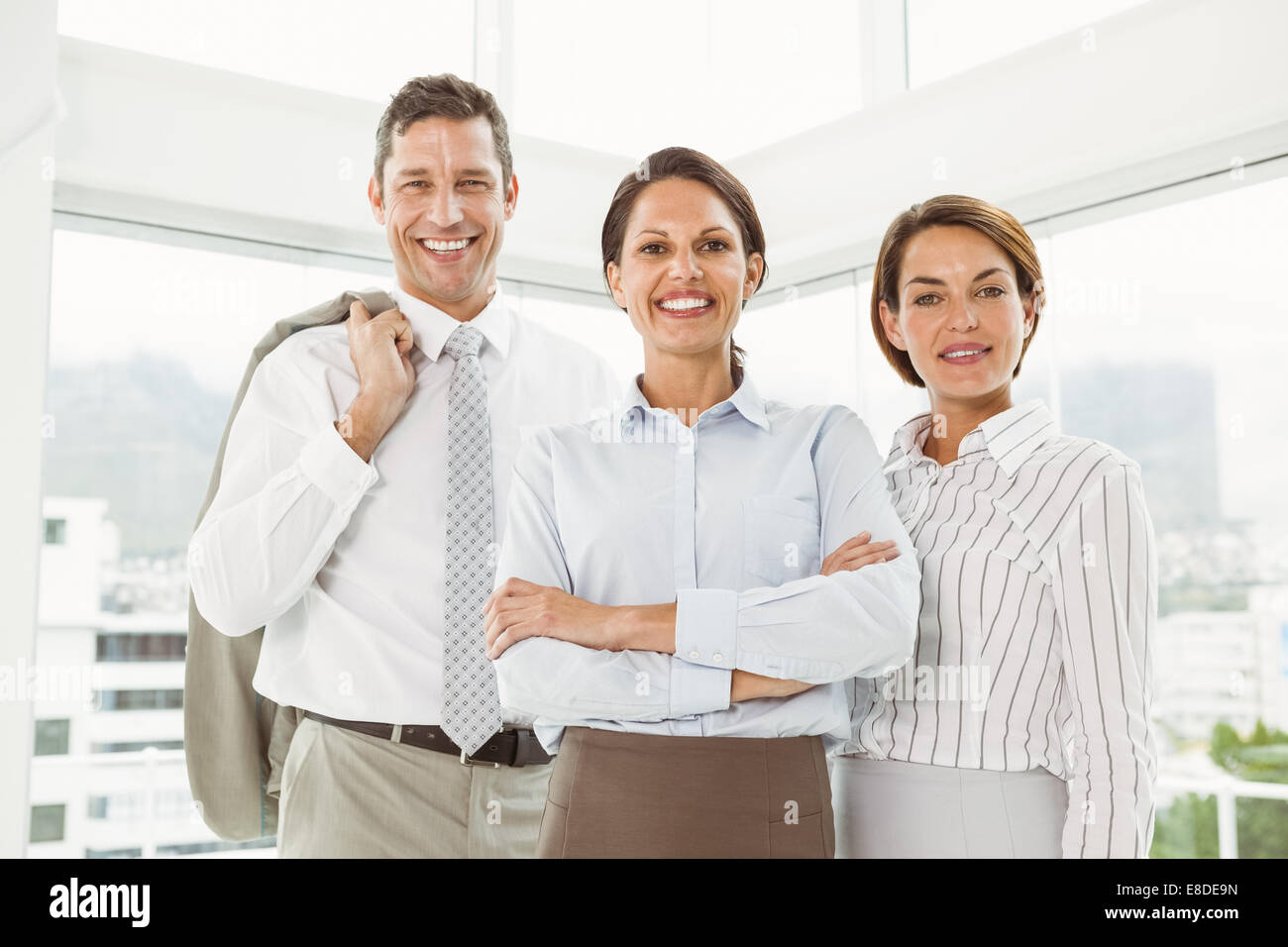 Confident business people with arms crossed in office Stock Photo - Alamy