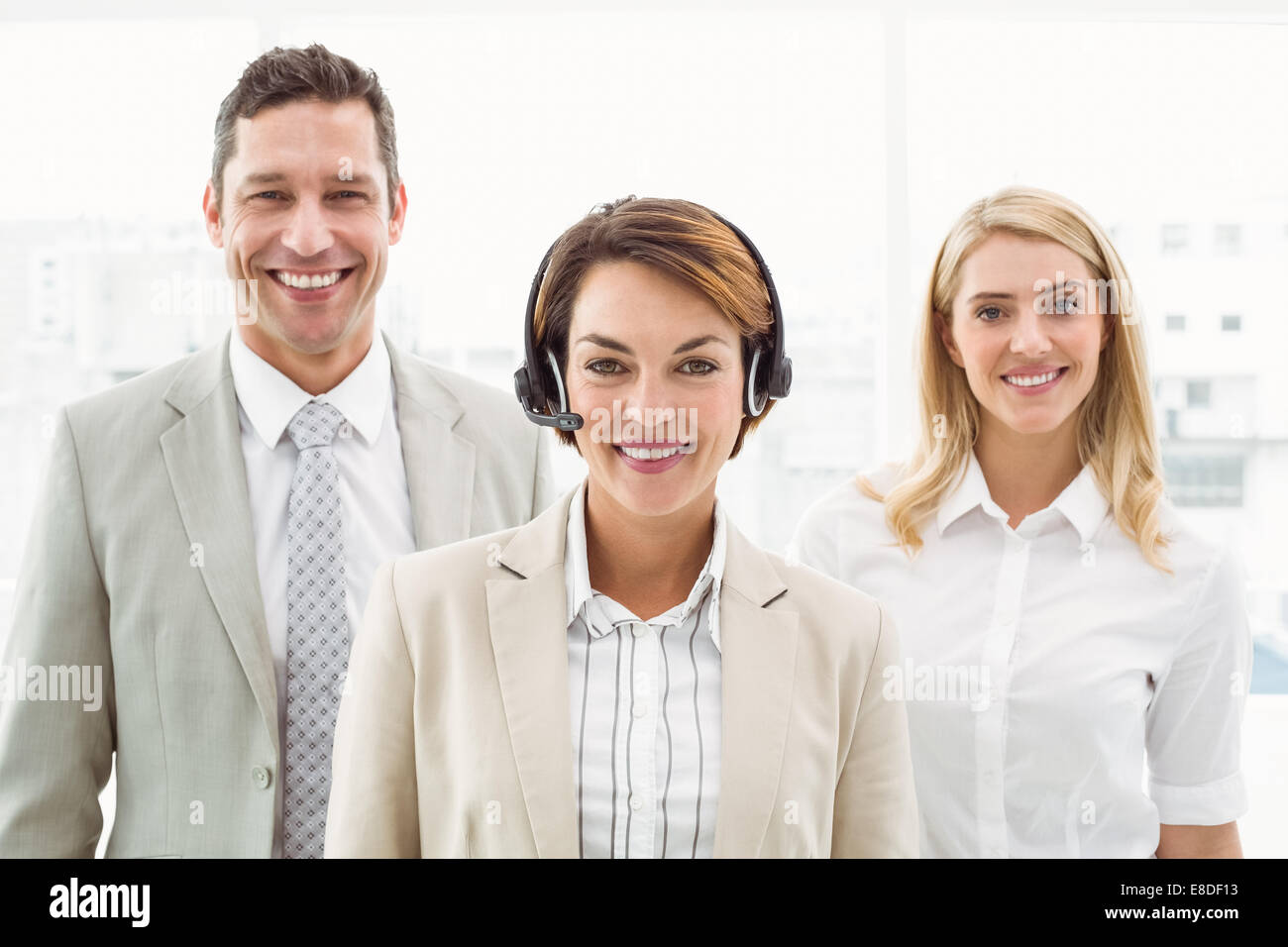 Happy young business people in office Stock Photo - Alamy