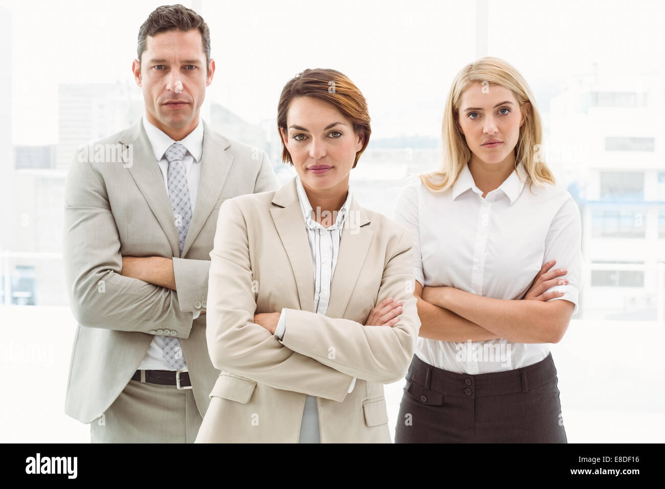 Confident business people with arms crossed in office Stock Photo - Alamy