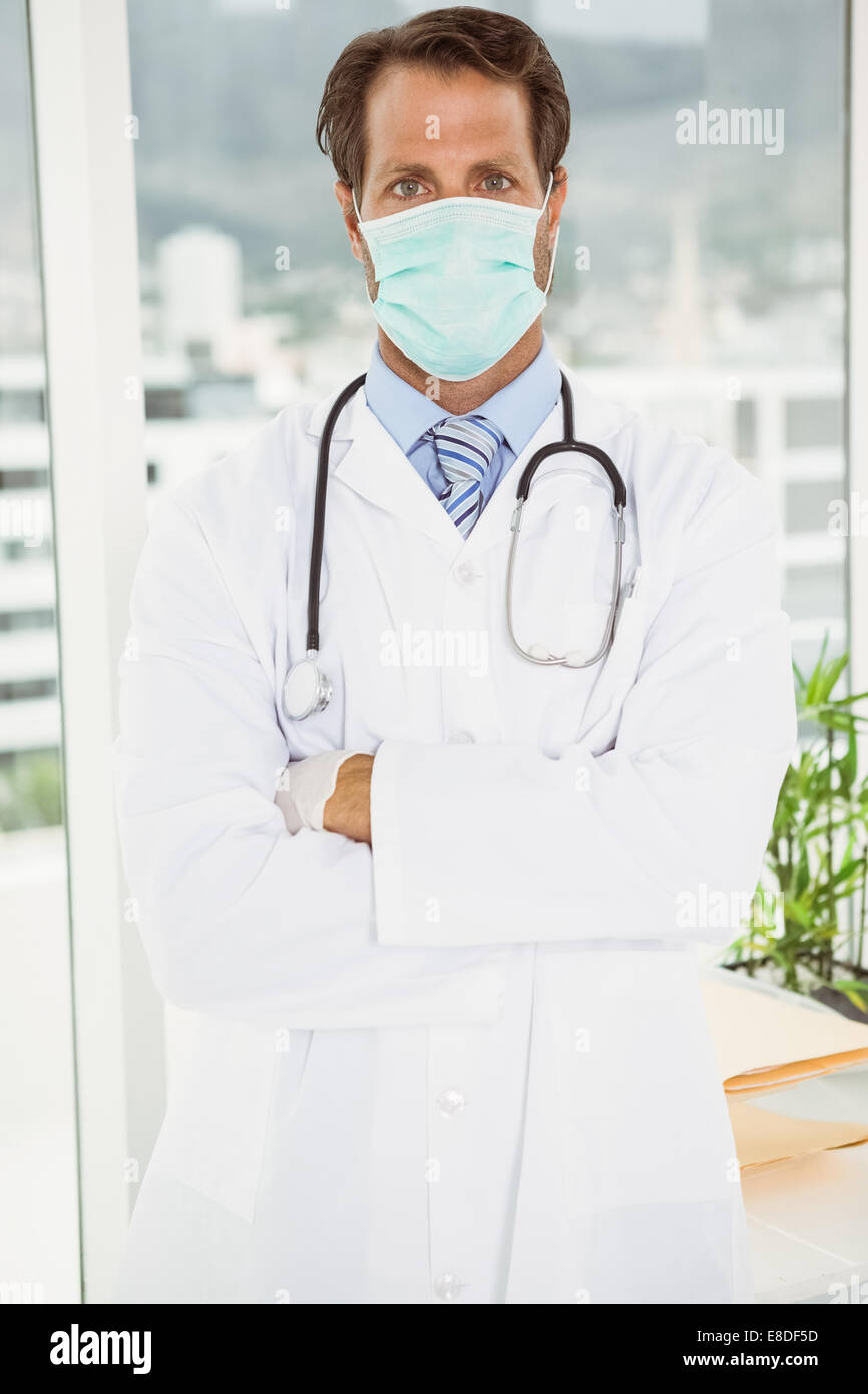 Doctor wearing surgical mask in hospital Stock Photo Alamy