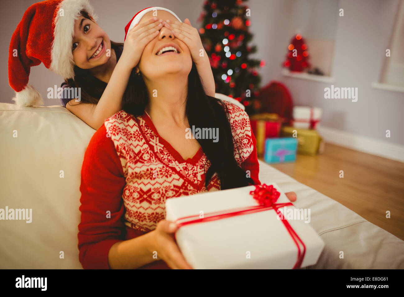 Mother giving Christmas gift to her child stock photo (133195