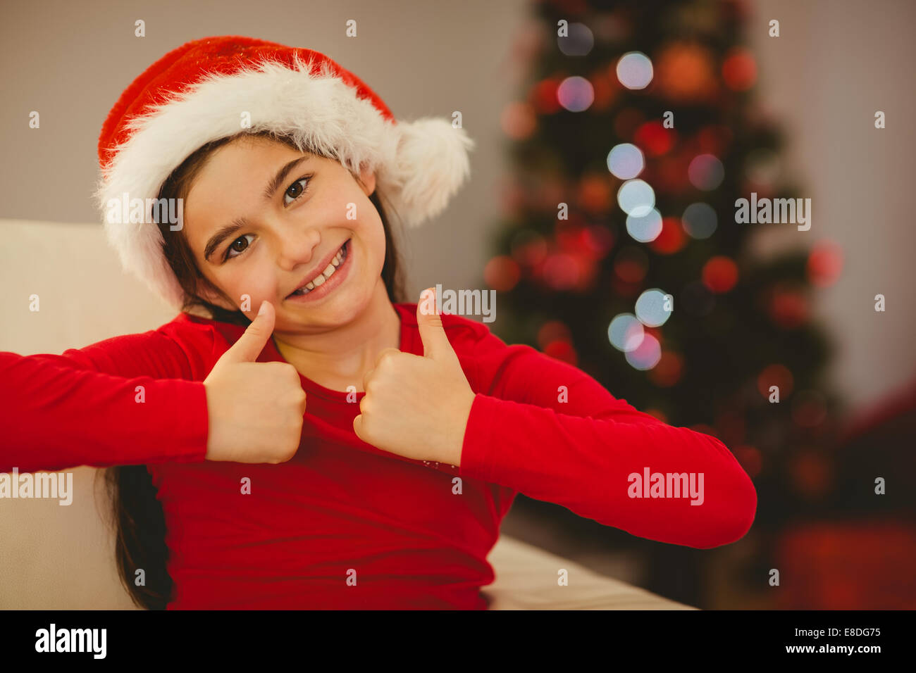 Festive little girl smiling at camera Stock Photo - Alamy