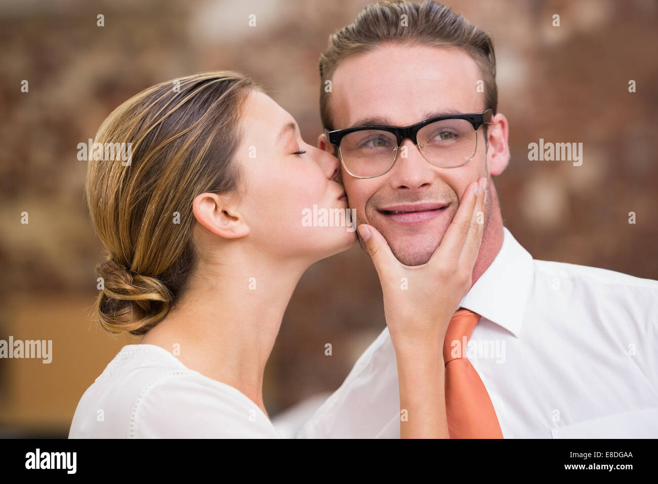 Young woman kissing man Stock Photo Alamy