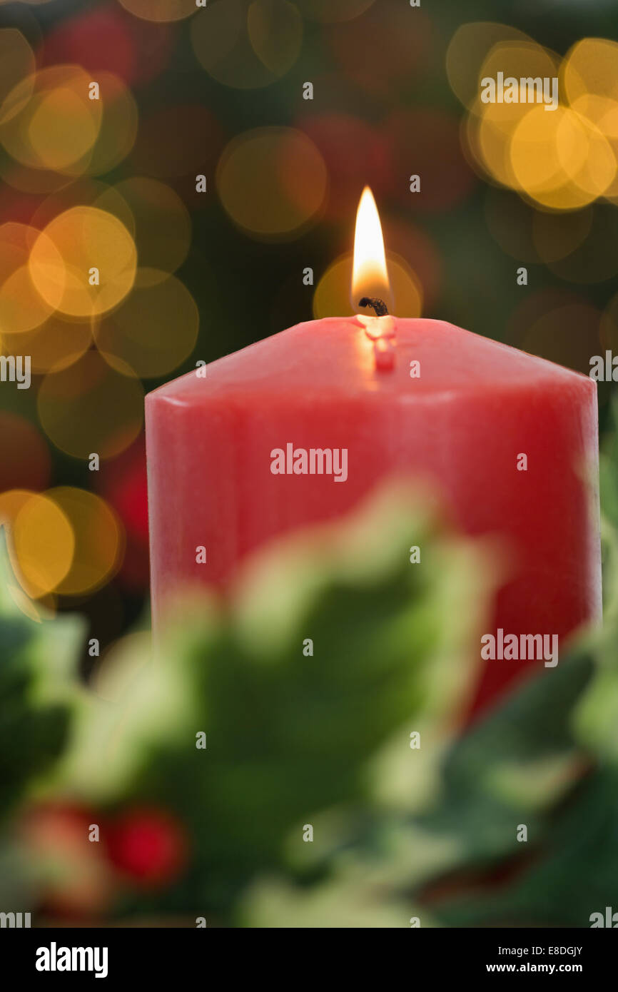 Large red candle burning bright Stock Photo - Alamy