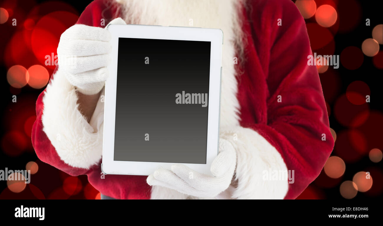 Composite image of santa claus showing tablet pc Stock Photo - Alamy