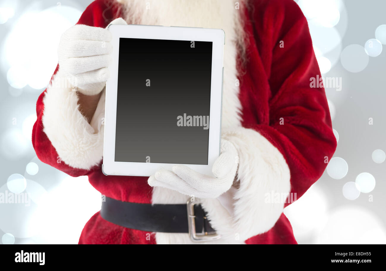 Composite image of santa claus showing tablet pc Stock Photo - Alamy