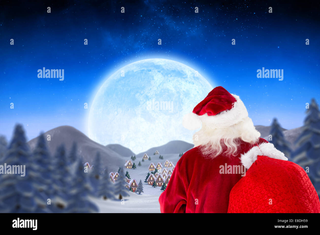 Composite image of santa claus carrying sack Stock Photo - Alamy