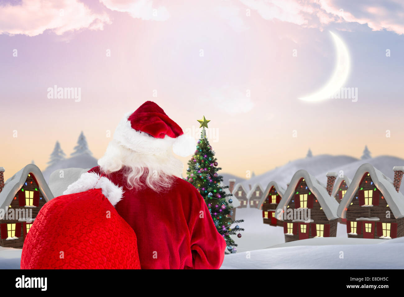 Composite image of santa claus carrying sack Stock Photo - Alamy