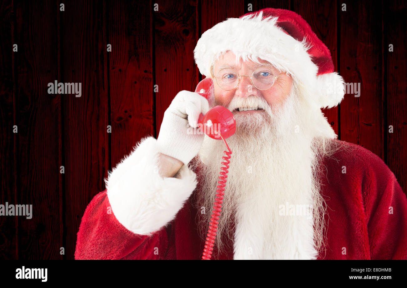 Composite image of santa claus on the phone Stock Photo - Alamy