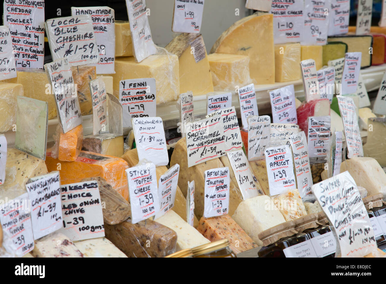 Home made cheeses on a market stall, England, UK Stock Photo Alamy