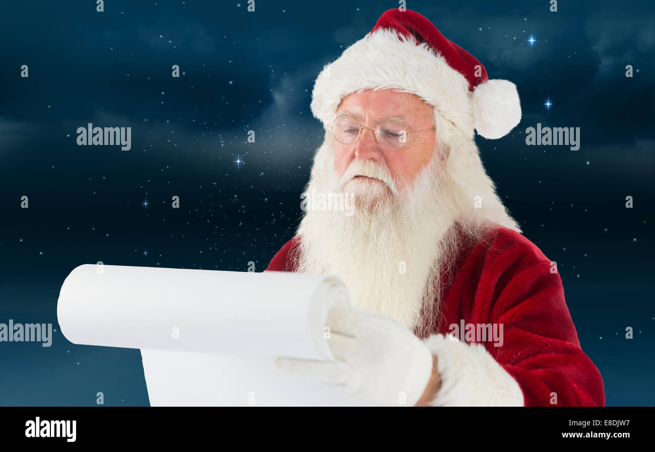 Composite image of santa claus checking his list Stock Photo - Alamy