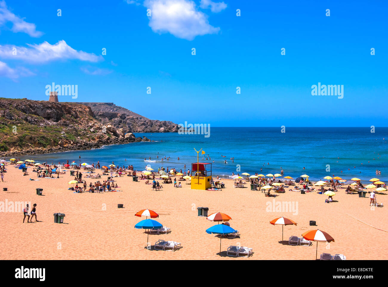 Malta: View over the sandy Golden Bay beach with a watchtower in the background in the northwestern part of Malta. Stock Photo