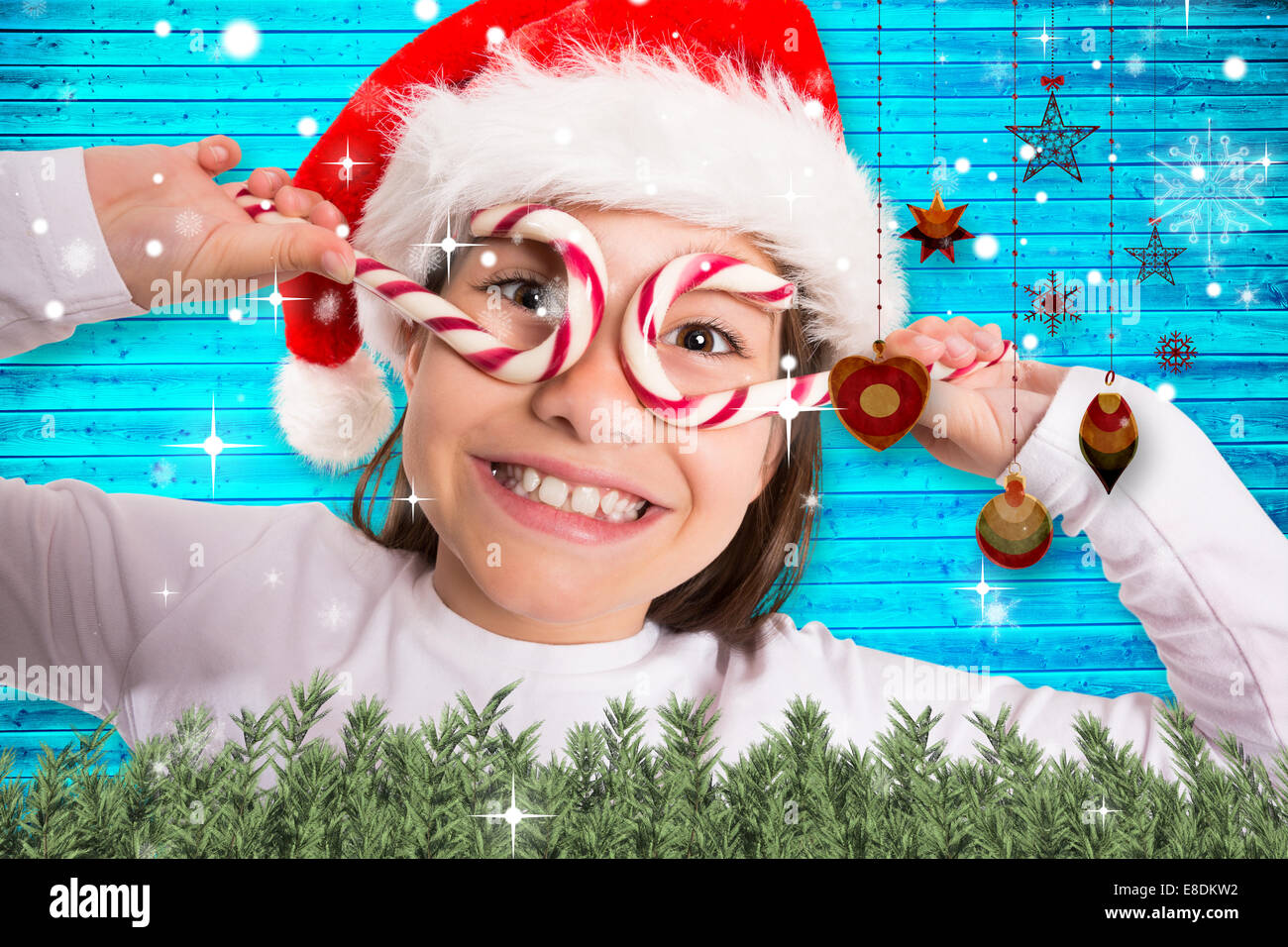 Composite image of festive little girl smiling at camera Stock Photo ...