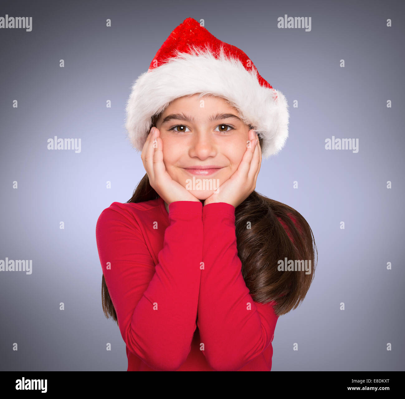 Composite image of festive little girl smiling at camera Stock Photo ...
