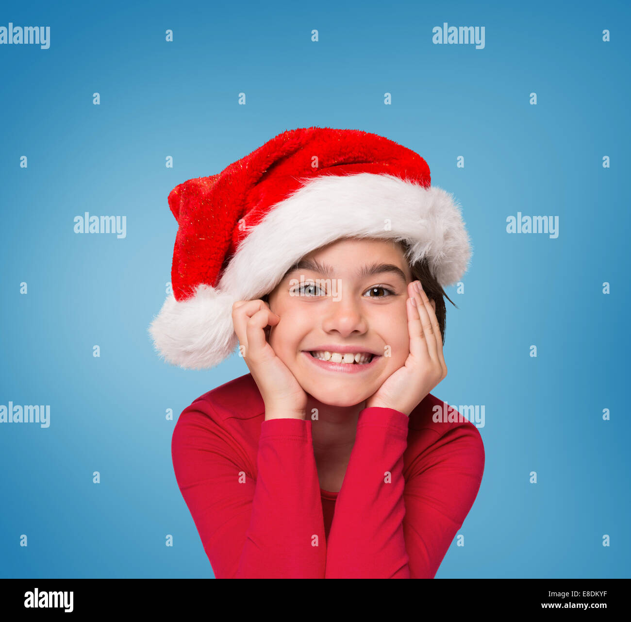 Composite image of festive little girl smiling at camera Stock Photo ...