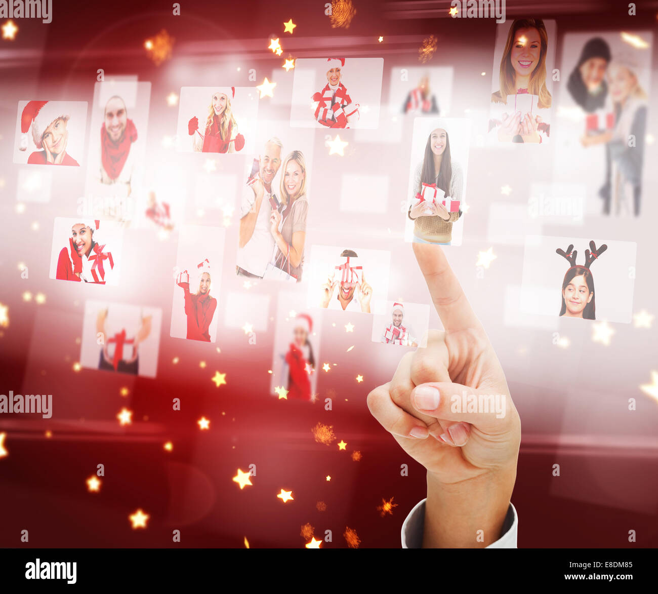 Composite image of hand pointing to christmas people collage Stock ...