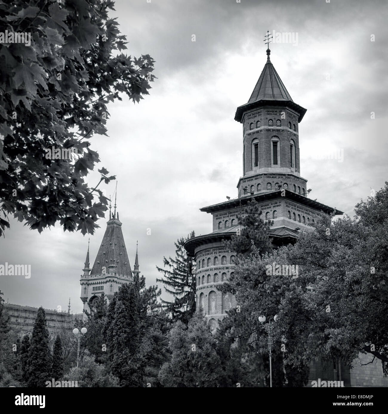 Black and white photograph of Saint Nicolae (Nicholas) Church with Culture Palace in the background in Iasi, Romania. Stock Photo