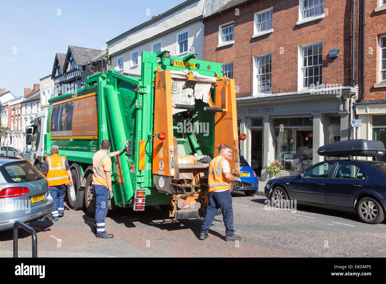 Refuse collectors in town center collection, England, UK Stock Photo