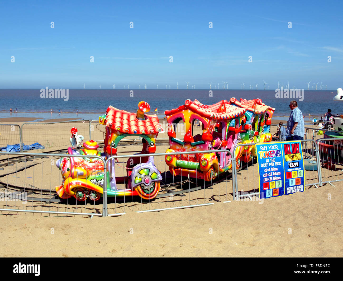 A colorful children's train ride on the sands at Ingoldmells, Skegness, Lincolnshire, England, UK. Stock Photo