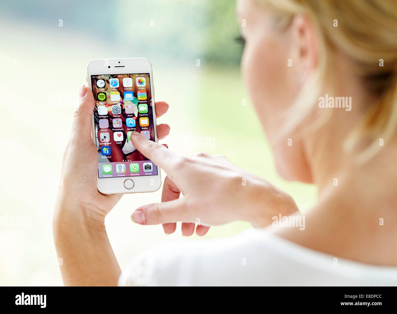 Girl using an iPhone6 Stock Photo