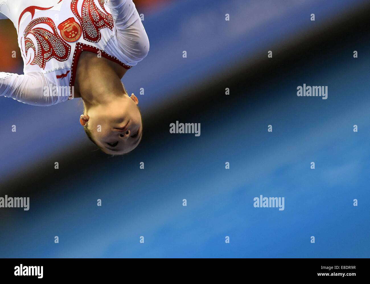 Nanning, China's Guangxi Zhuang Autonomous Region. 6th Oct, 2014. Yao Jinnan of China performs on the balance beam during the women's qualifying round of the 45th Gymnastics World Championships in Nanning, capital of south China's Guangxi Zhuang Autonomous Region, Oct. 6, 2014. The 45th FIG Artistic Gymnastics World Championships lasts from Oct. 3 to 12 in Nanning. Credit:  Huang Xiaobang/Xinhua/Alamy Live News Stock Photo