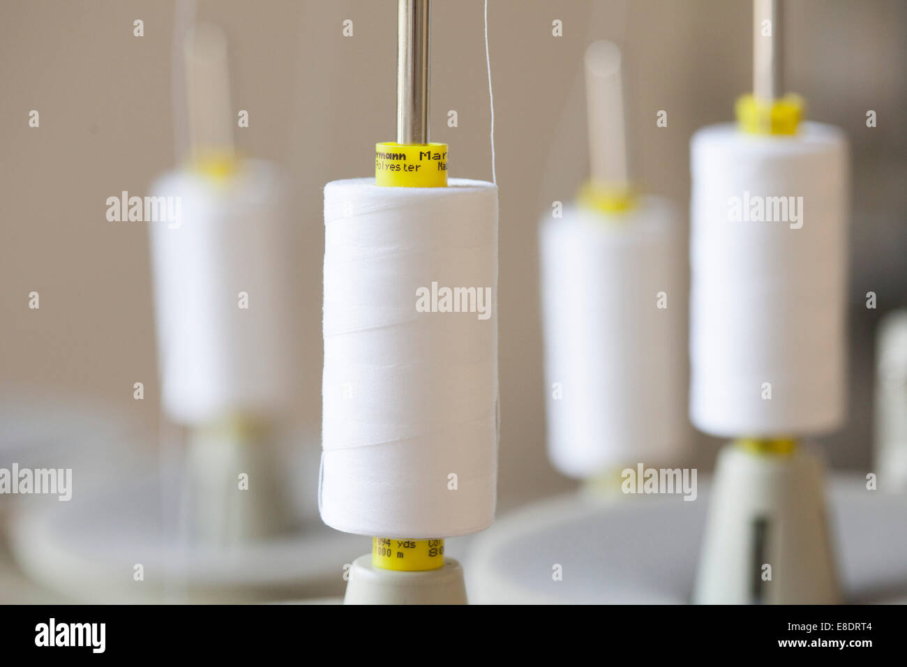 cotton reel on a sewing machine Stock Photo Alamy