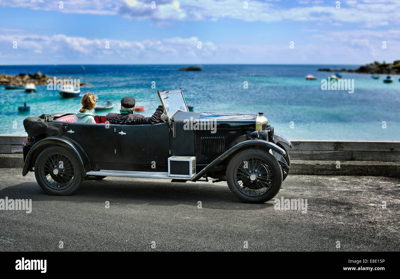 A old Morris 9 vintage car stopped at old town bay on St Marys,Isles of Scilly, Stock Photo