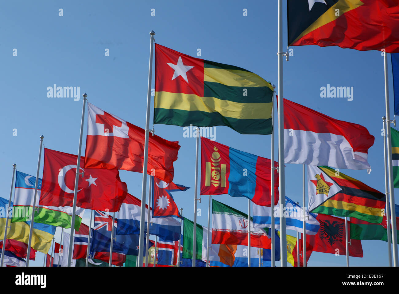 Many Flags blowing in the wind Stock Photo