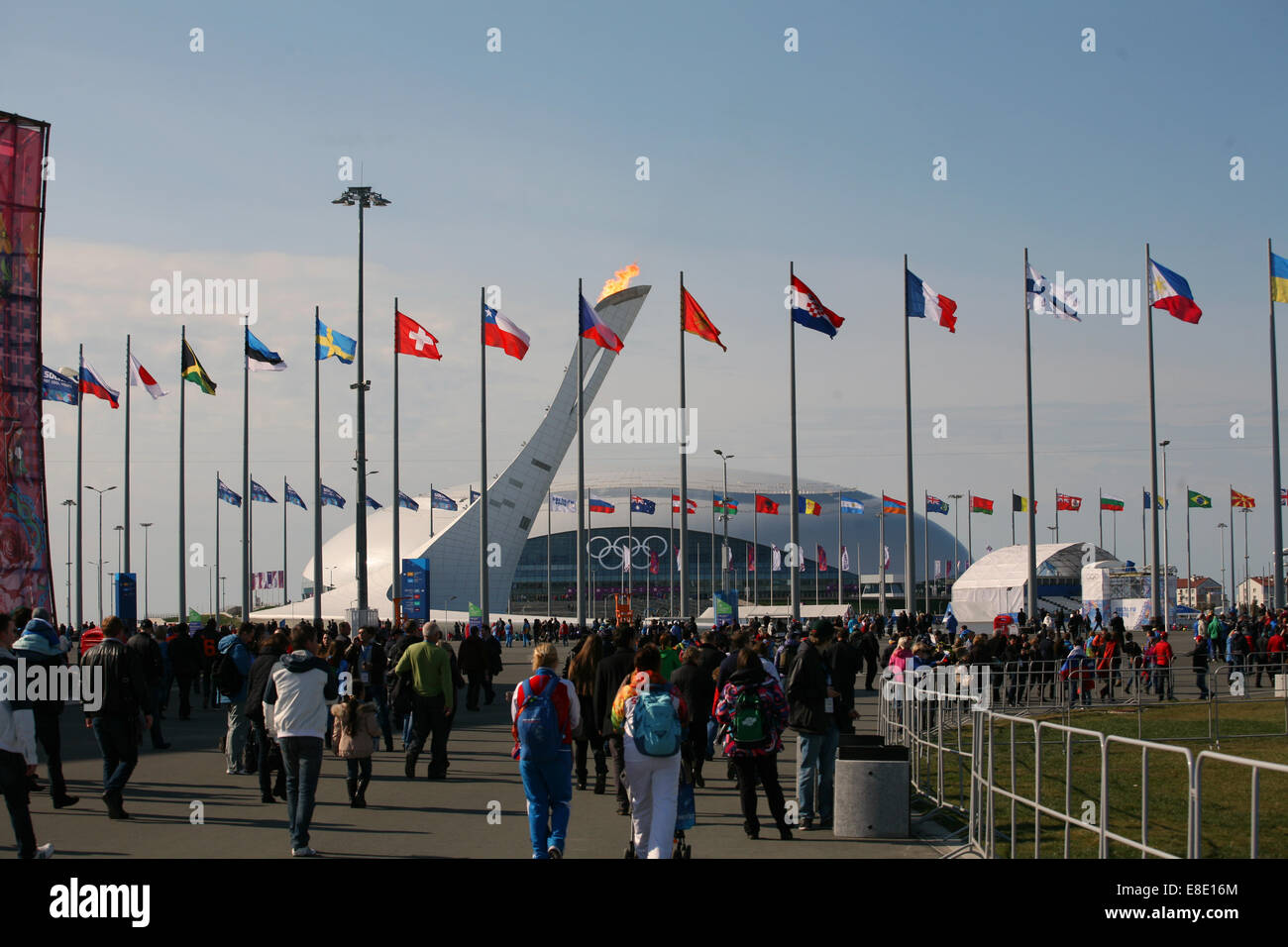 Olympic flags surrounding the Olympic flame Sochi Winter games2014 Stock Photo