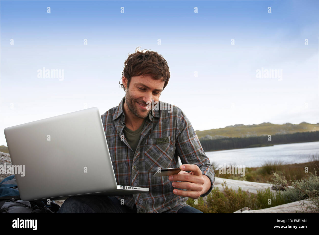 Tourist with a computer Stock Photo