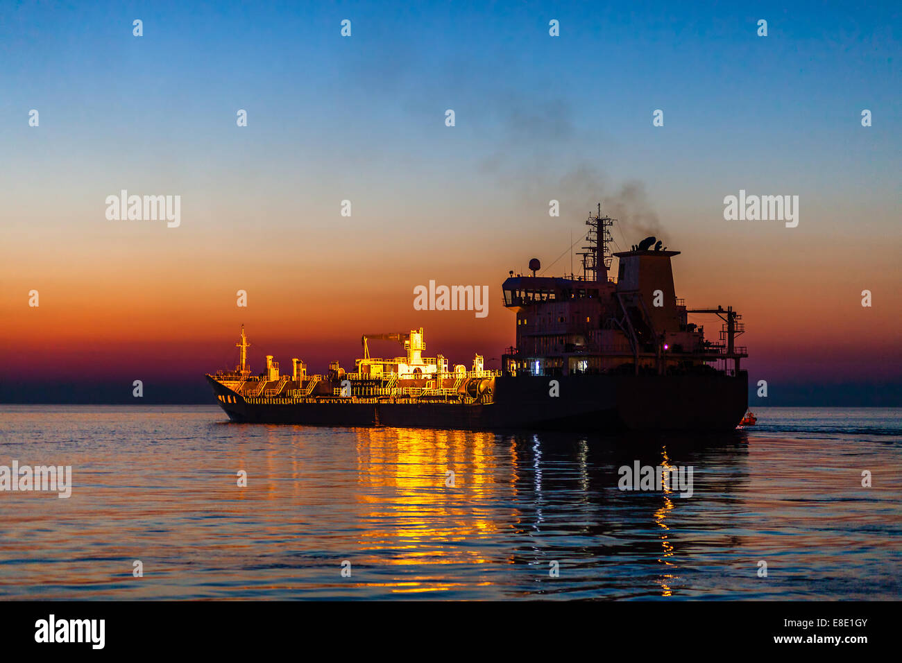 Ship swims on the sea at night. Stock Photo