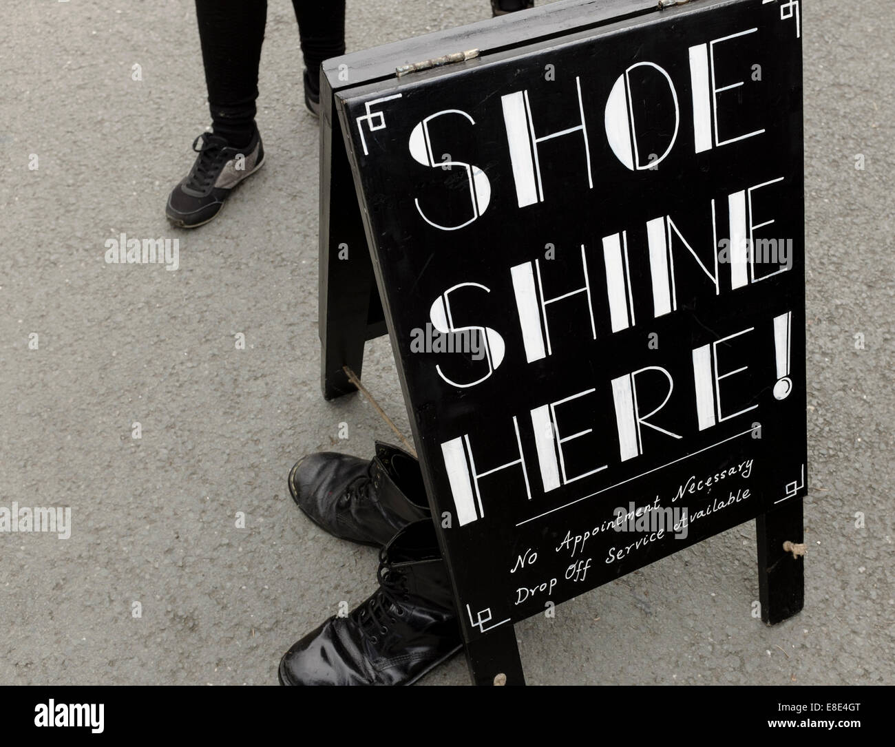 A a sign for 'Shoe Shine Here' near the Dr Martens shop, during 'Festival  No.6'. 6th September 2014, Portmeirion, North Wales,UK Stock Photo - Alamy