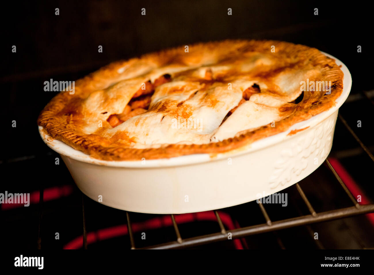 three apple pies cooking in the oven Stock Photo Alamy