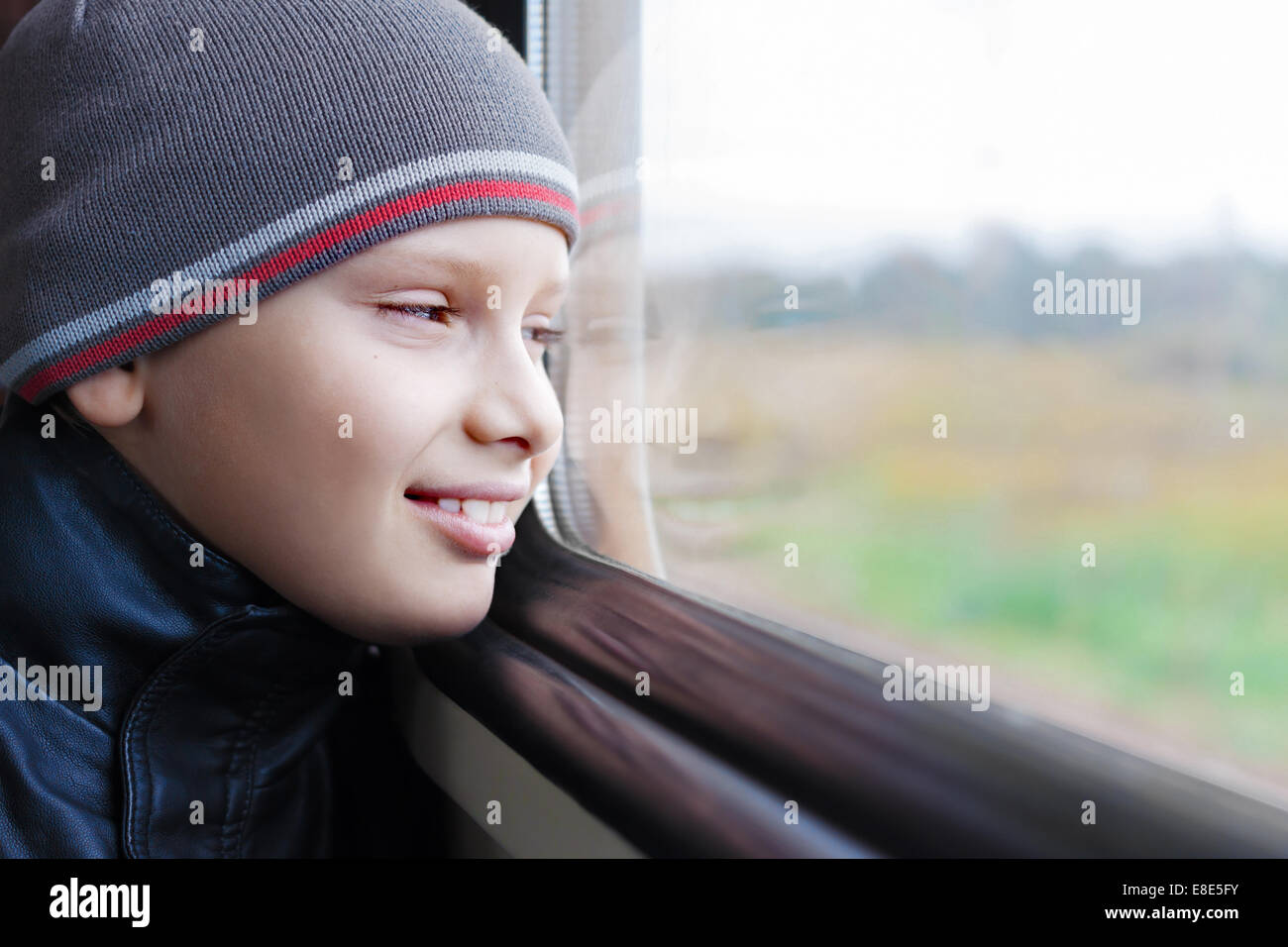 kid cute smile train look window travel Stock Photo