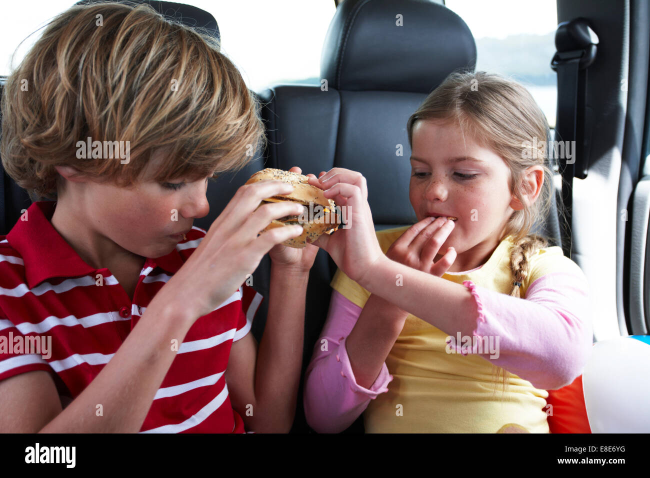 Kids eating a snack Stock Photo - Alamy