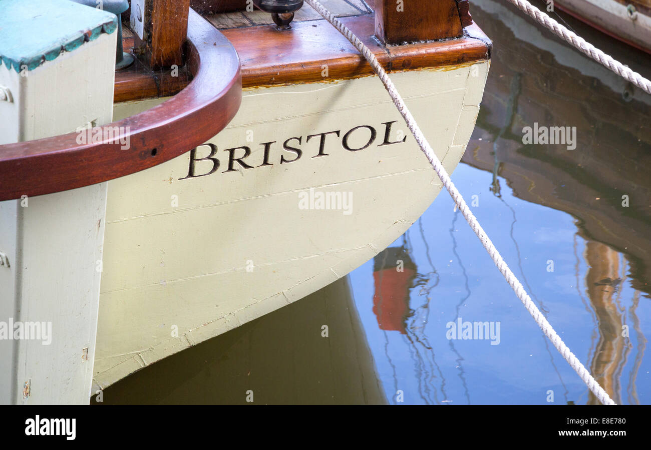 Stern of a wooden boat from Bristol UK moored up in a boat yard on the floating harbour Stock Photo