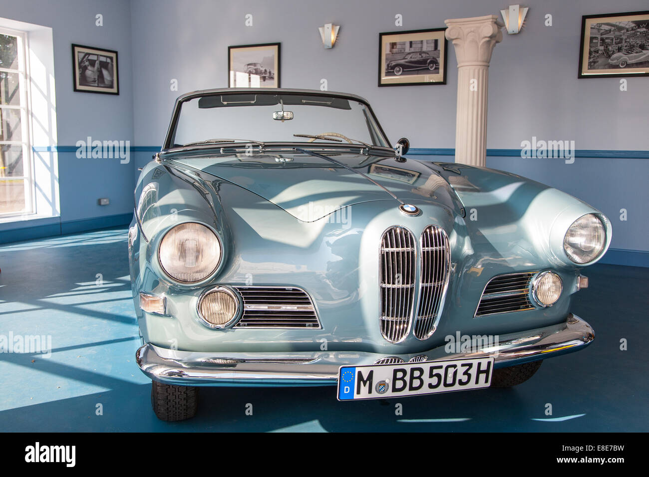 Replica of BMW's Park Lane dealership from the Fifties displaying a Classic BMW 502 saloon. Goodwood Revival 2014, West Sussex Stock Photo