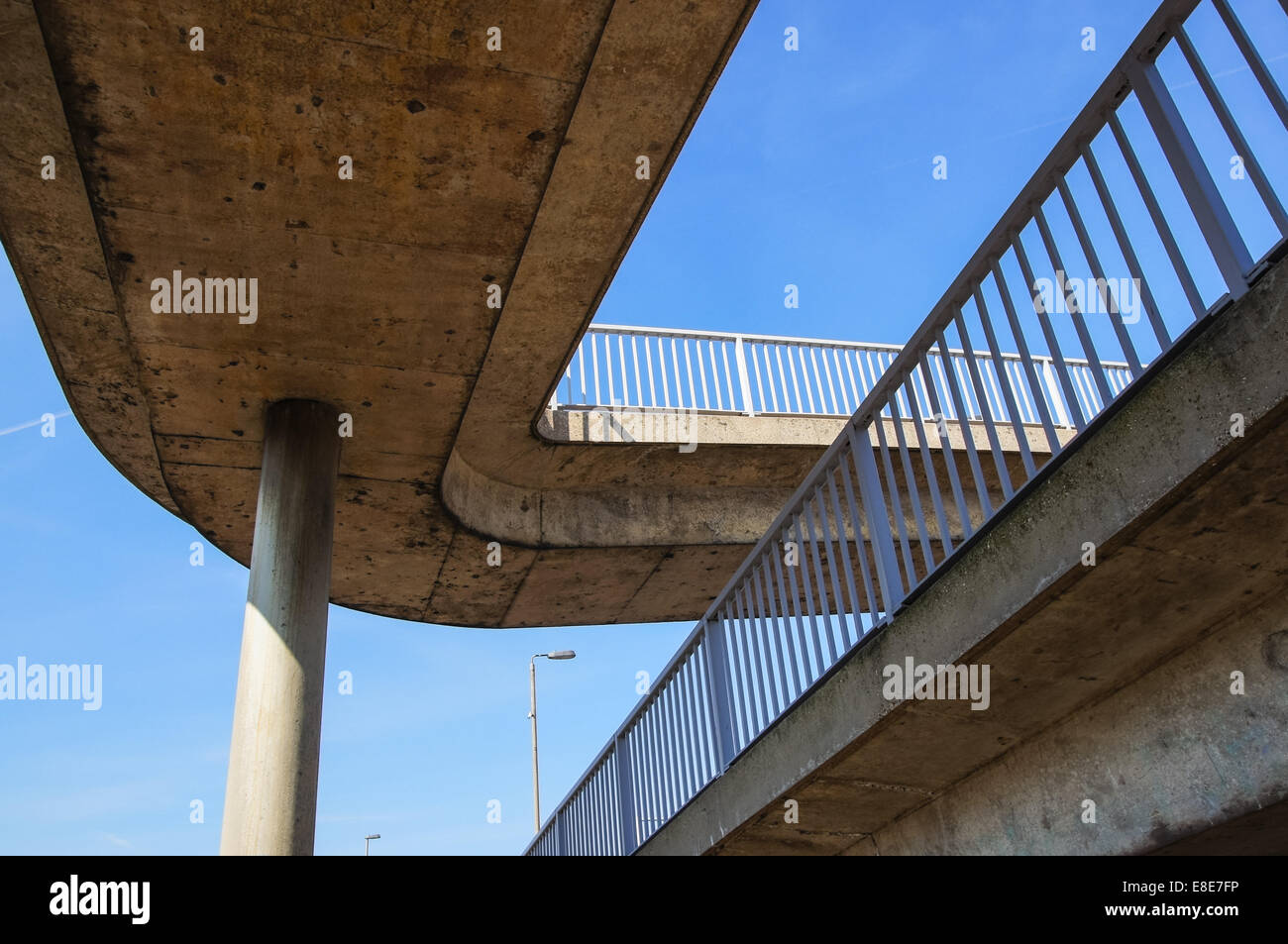 concrete footbridge, elevated overpass with blue sky Stock Photo