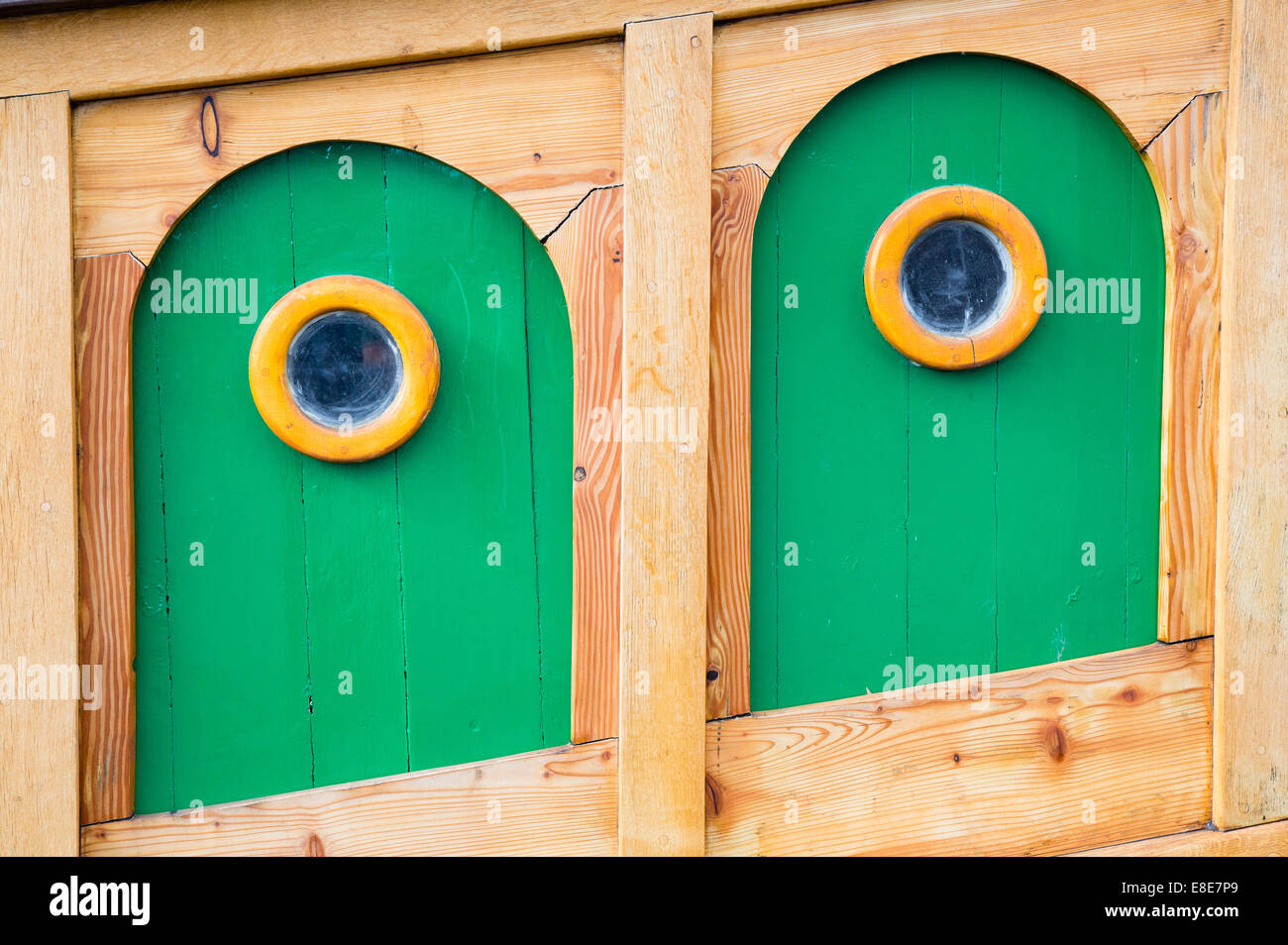 Panels and portholes on the wooden hull of The Matthew replica Tudor sailing ship in the harbour at Bristol UK Stock Photo