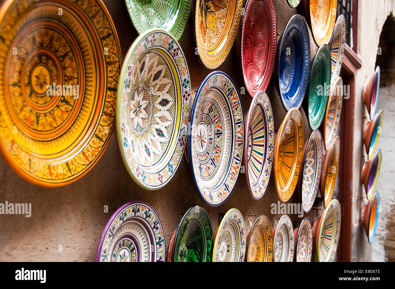 Horizontal close up of rows of colourful plates displayed in Essaouira Stock Photo
