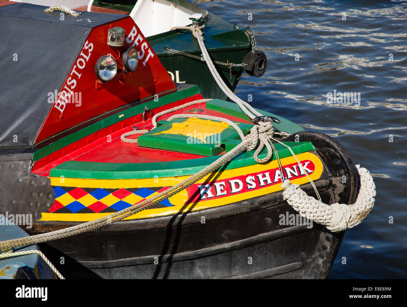 Brightly painted prow of a canal barge the redshank in the floating harbour in Bristol UK Stock Photo