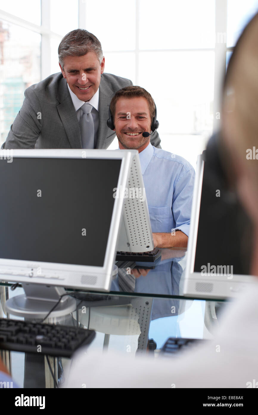 Older and younger businessmen at work Stock Photo