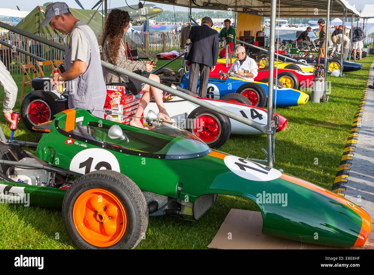 A line of vintage classic Lotus racing cars in the pit area at the Goodwood Revival 2014, West Sussex, UK Stock Photo