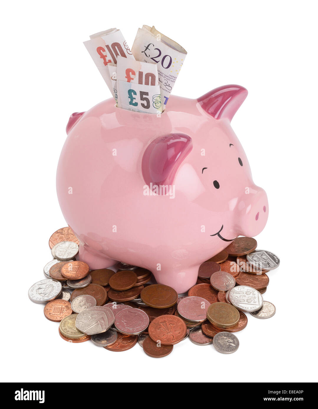 Pink piggy bank with UK sterling coins and notes Stock Photo