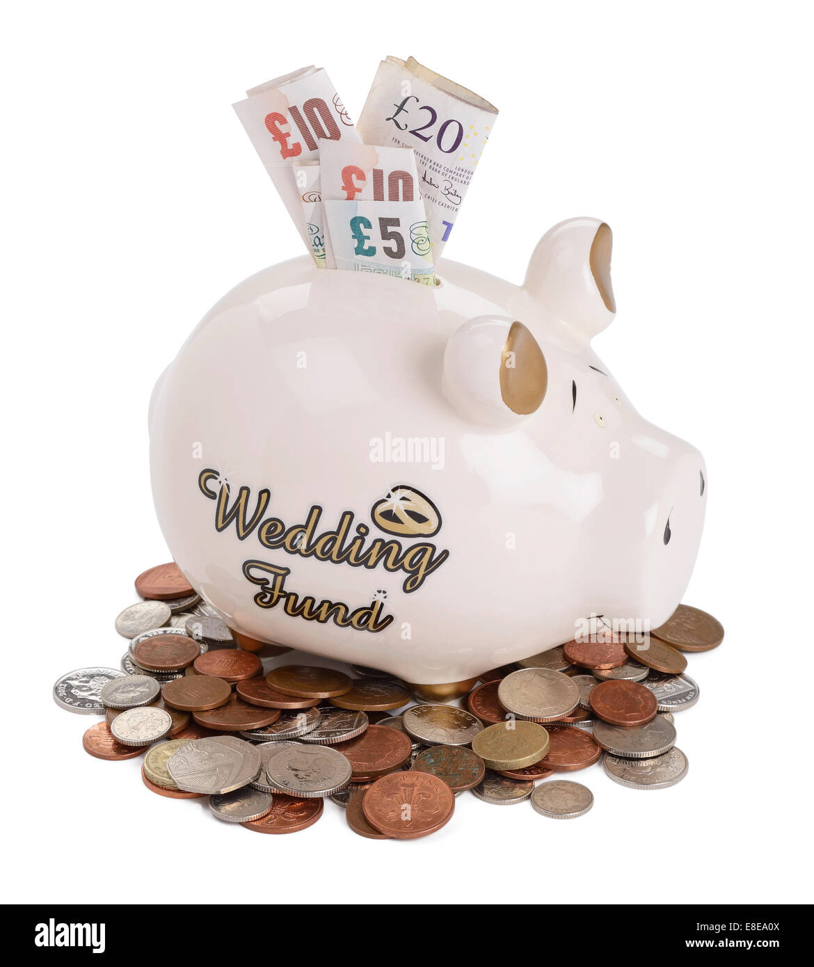 Wedding fund piggy bank with UK sterling coins and notes Stock Photo